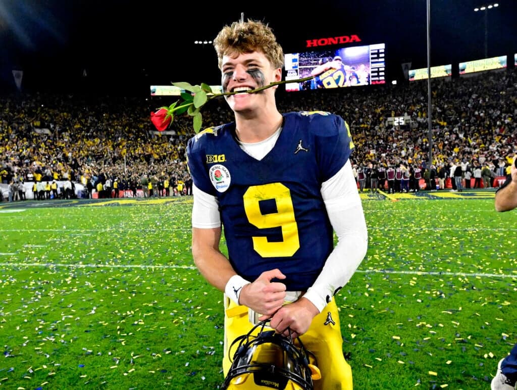 Pasadena, CA - January 01: Quarterback J.J. McCarthy #9 of the Michigan Wolverines celebrates with a rose after defeating Alabama Crimson Tide 27-20 in overtime to win the 110th Rose Bowl game in Pasadena on Monday, January 1, 2024. (Photo by Keith Birmingham/MediaNews Group/Pasadena Star-News via Getty Images)