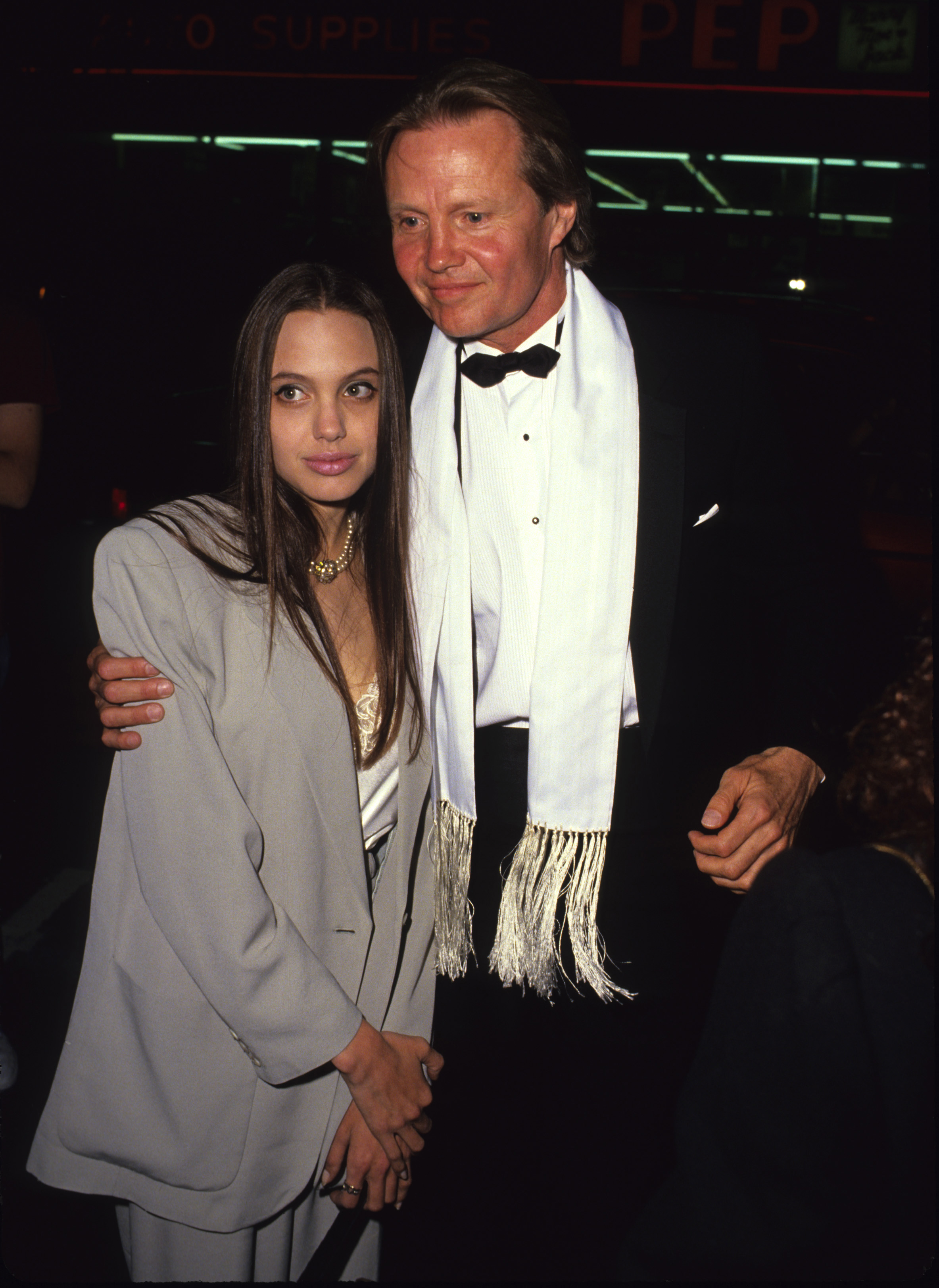 Angelina (seen here with Jon Voight) had her jawline taken down a couple of notches, said a plastic surgeon as her jaw over-projected