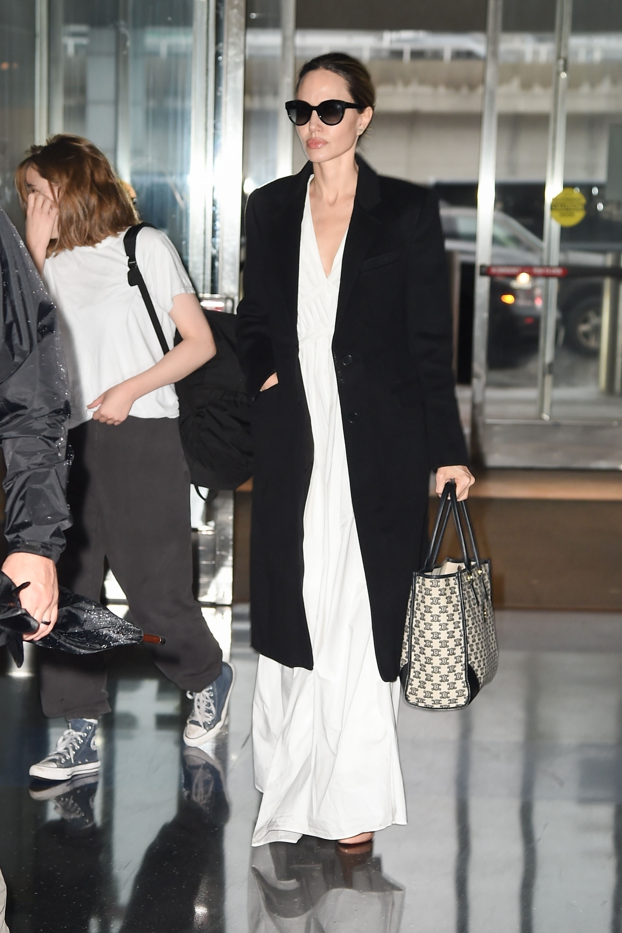 Angelina Jolie was photographed with her rarely-seen daughter, Vivienne, 15, at the JFK airport