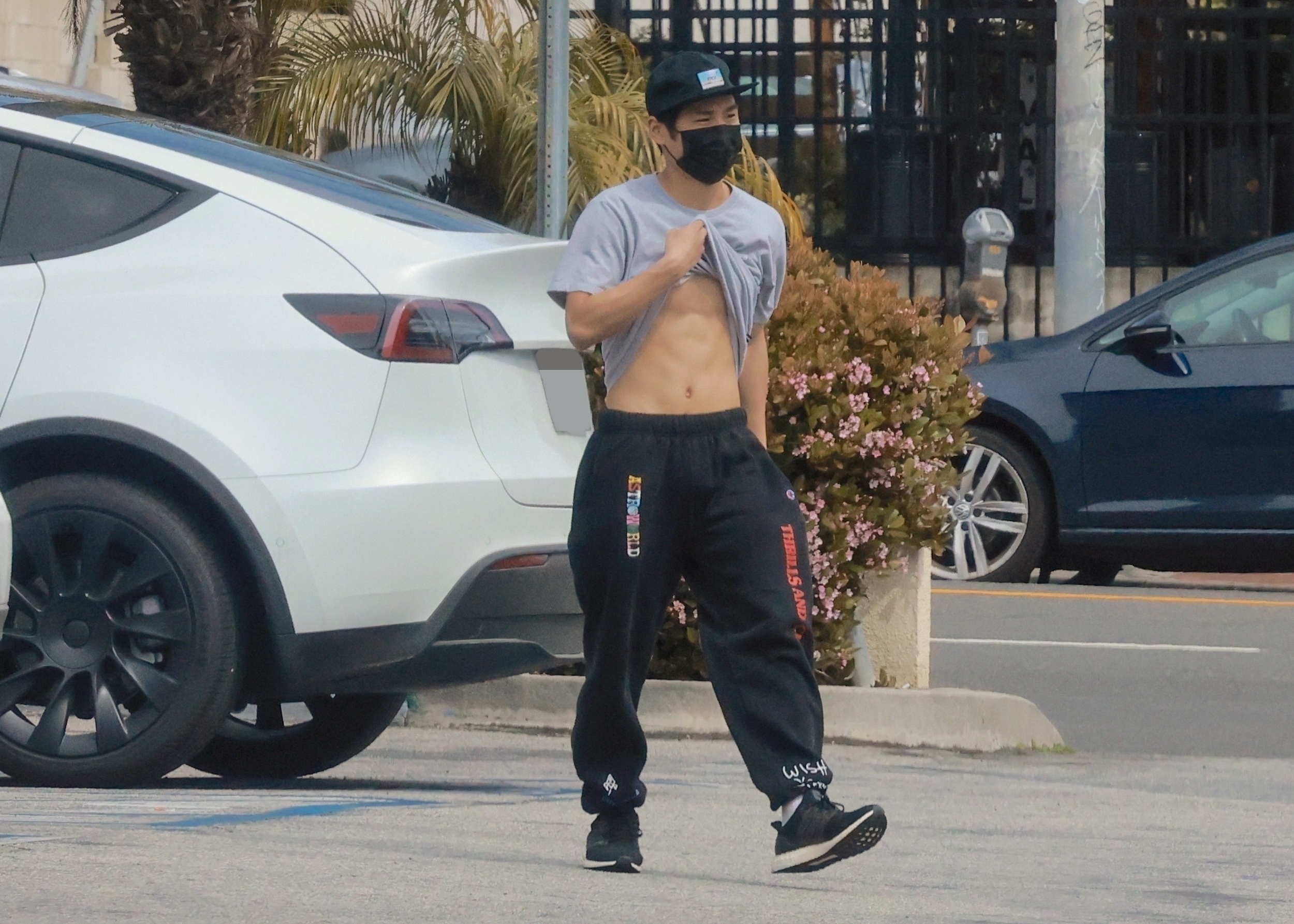 The 19-year-old was proud of his abs and defiantly showed them off in a parking lot