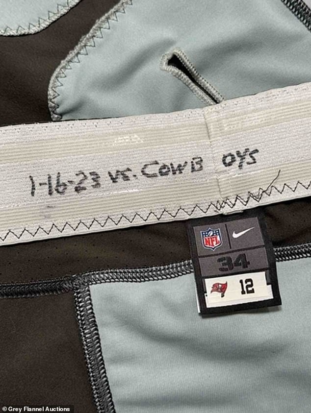 The pants, which show the game's date on the waistband, were sold for far less than the jersey